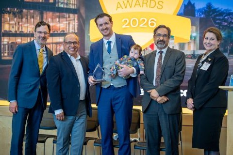 Samuel J. Kessler receiving an award, standing with the vice president for research development, vice president for research, the provost, and the associate vice president for research at the 2026 ARIA event.
