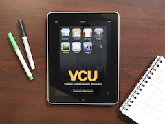 Tablet with VCU logo on it