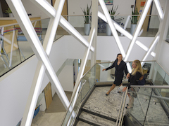 2 women walking up the staircase